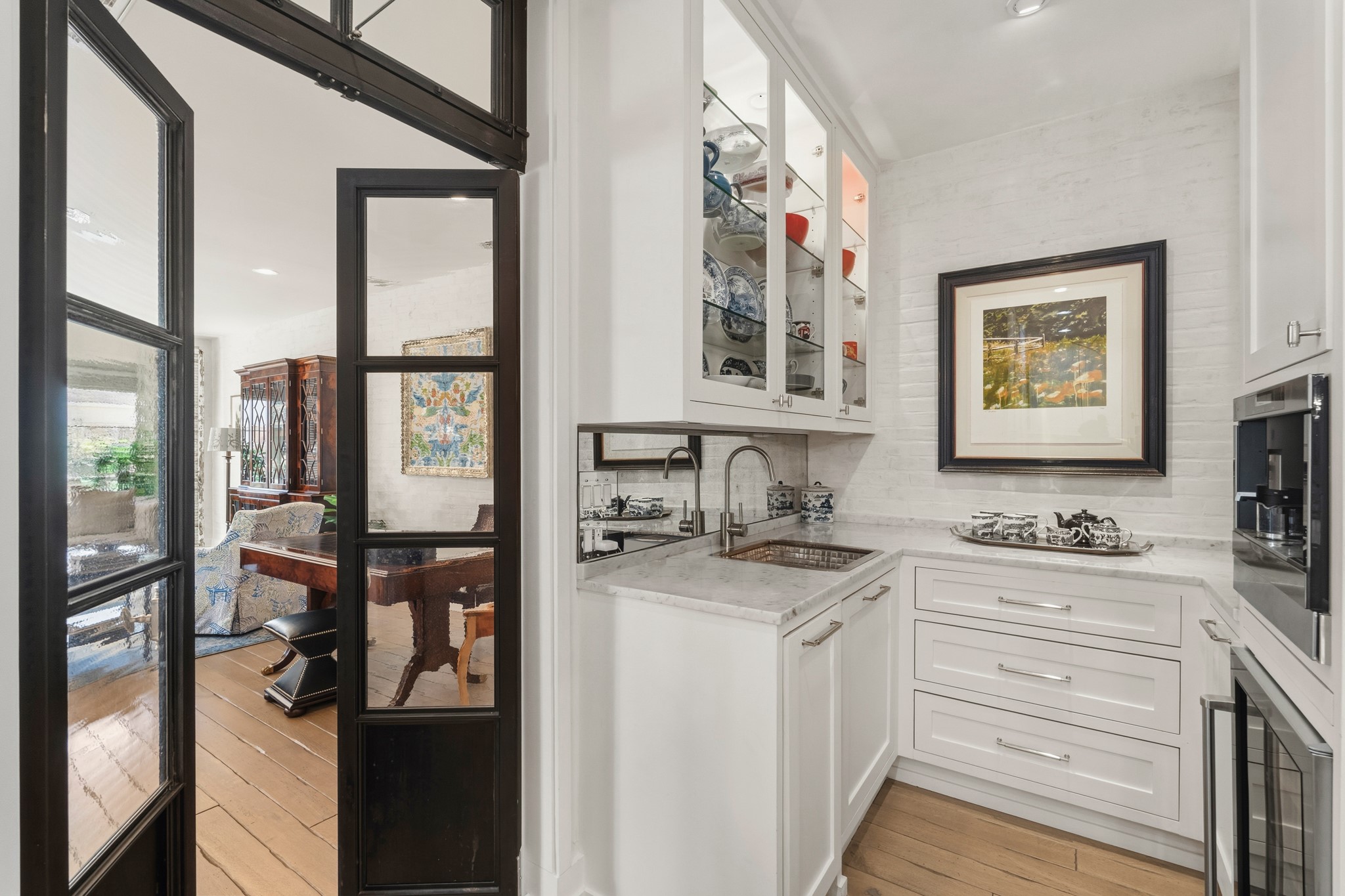 7606 Del Monte Drive Houston, TX 77063 - Photo 7 of 17 Elegant butler's pantry and wet bar featuring built-in Miele espresso machine and wine chiller.