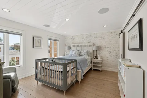 a bedroom with a bed and a table