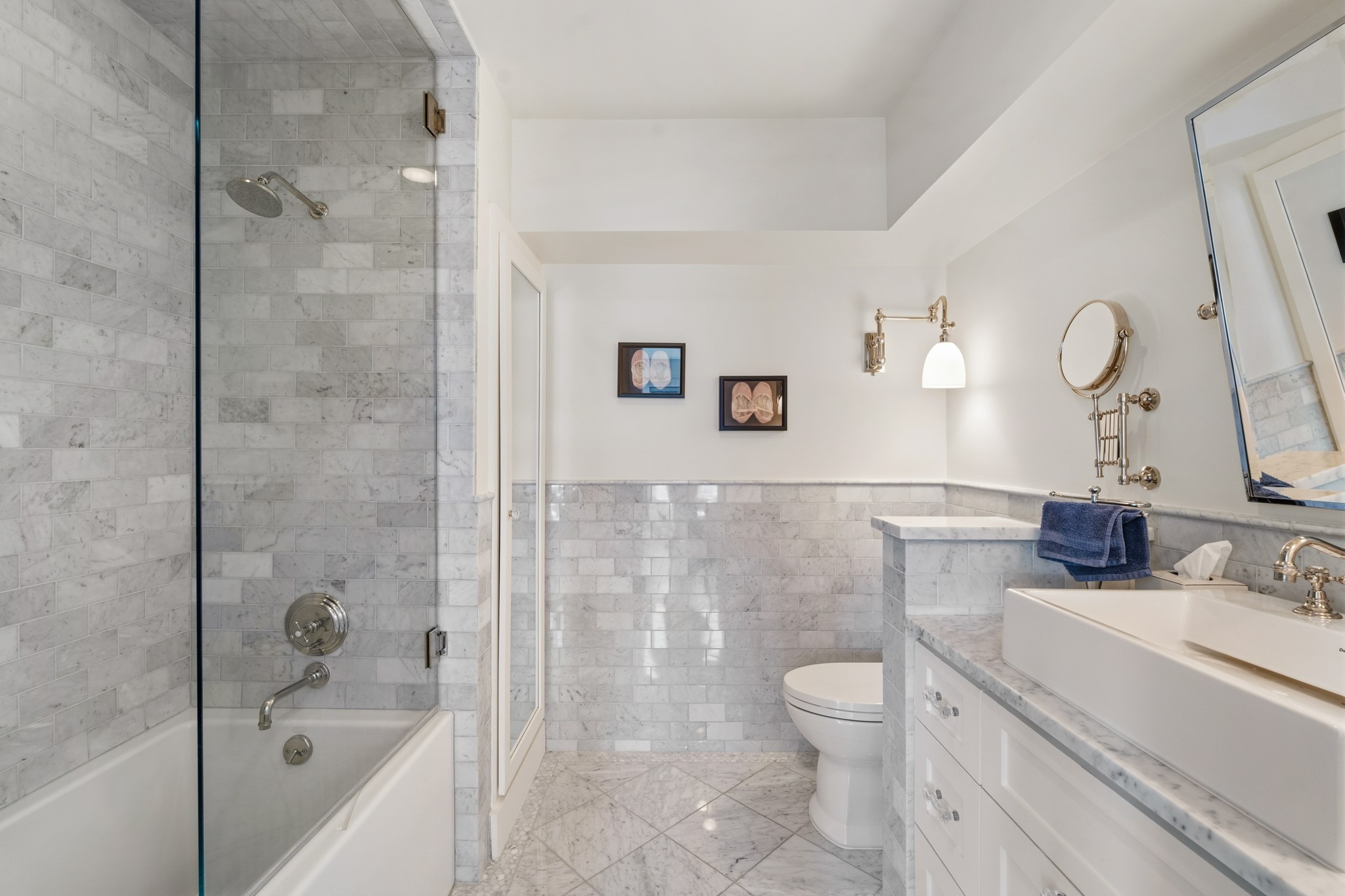 7606 Del Monte Drive Houston, TX 77063 - Photo 10 of 17 Elegantly appointed ensuite bathroom with marble countertops, designer fixtures, and abundant storage. Classic luxury finishes throughout this Hammersmith townhome.
