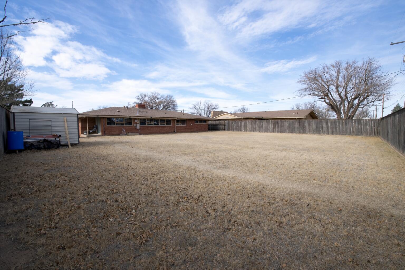 730 South 17th Street Slaton, TX 79364 - Photo 20 of 23 a view of a lake with houses in the back