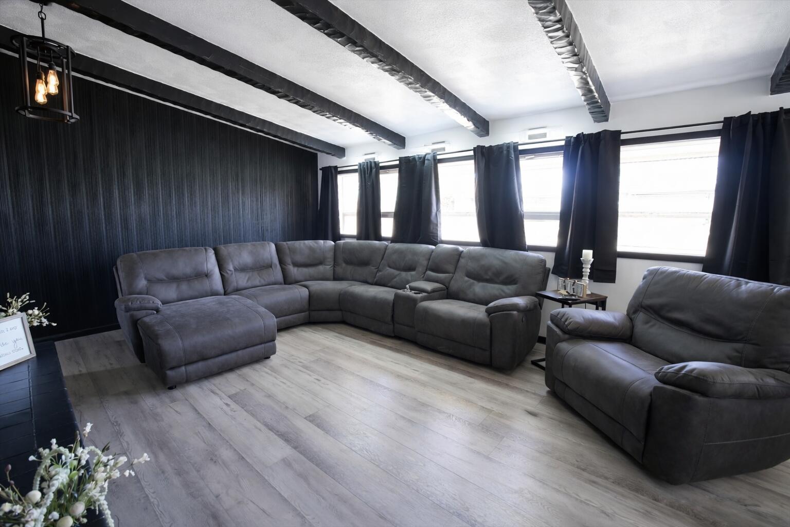 730 South 17th Street Slaton, TX 79364 - Photo 2 of 23 a living room with furniture and a fireplace