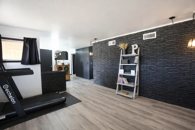 a view of a livingroom with furniture and wooden floor