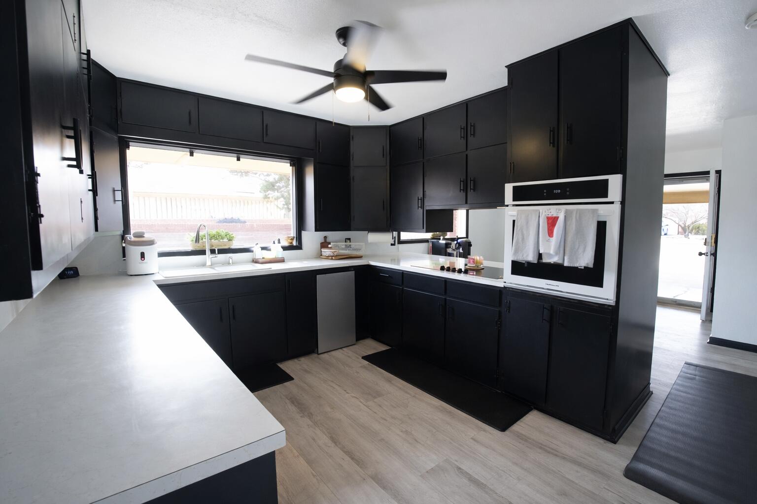 730 South 17th Street Slaton, TX 79364 - Photo 6 of 23 a kitchen with a sink a window and stainless steel appliances