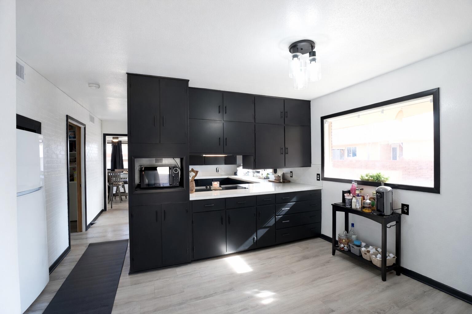 730 South 17th Street Slaton, TX 79364 - Photo 8 of 23 a kitchen with stainless steel appliances granite countertop a sink and a stove