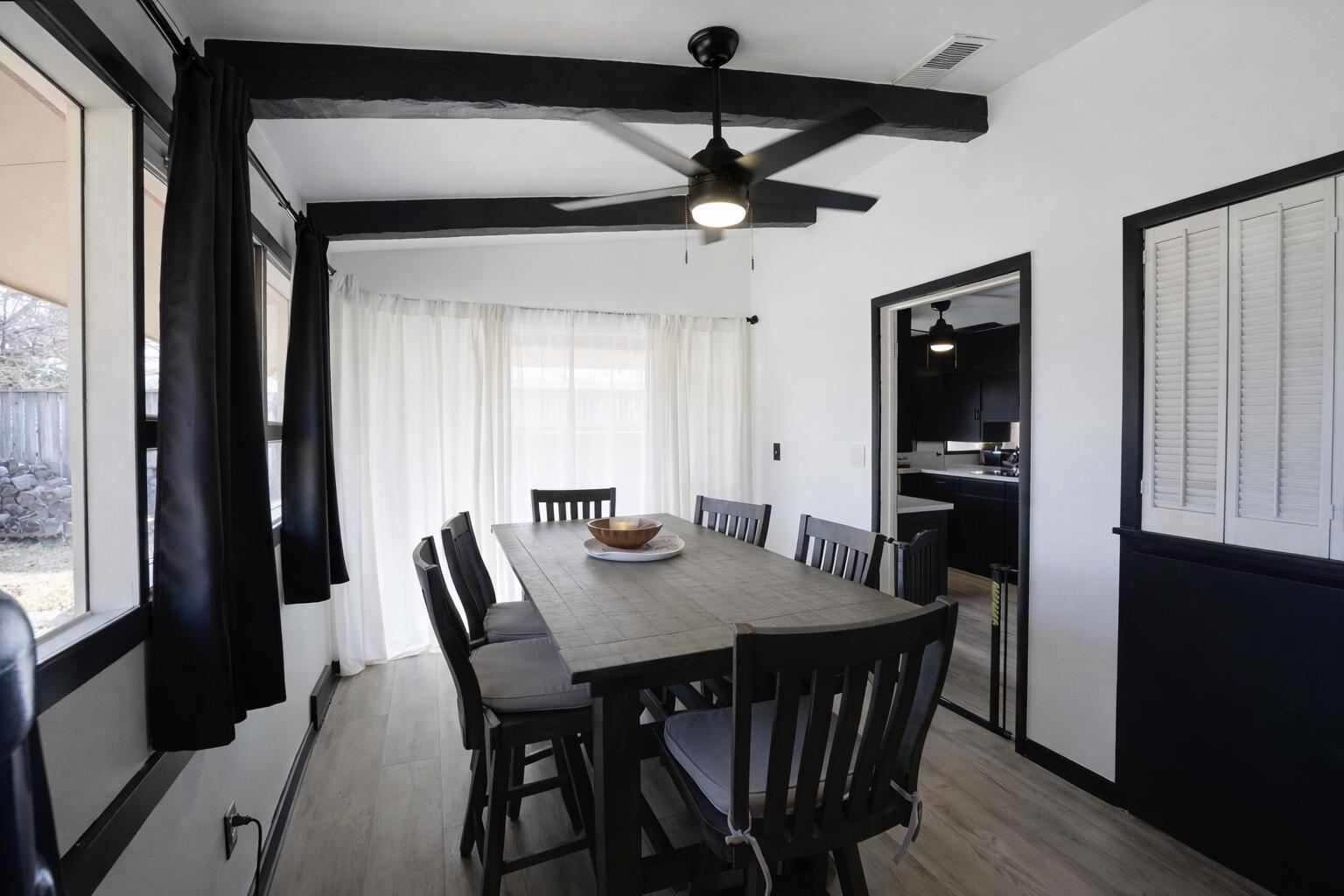 730 South 17th Street Slaton, TX 79364 - Photo 10 of 23 a view of a dining room with furniture and a window