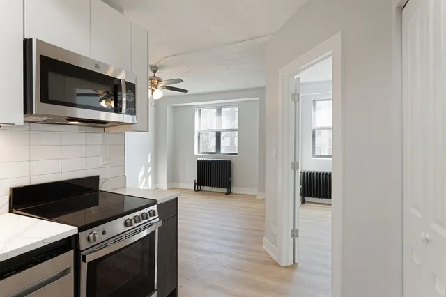 a kitchen with a stove and a microwave