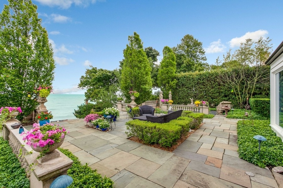 473 Sheridan Road Winnetka, IL 60093 - Photo 25 of 32 a view of a table and chairs and potted plants