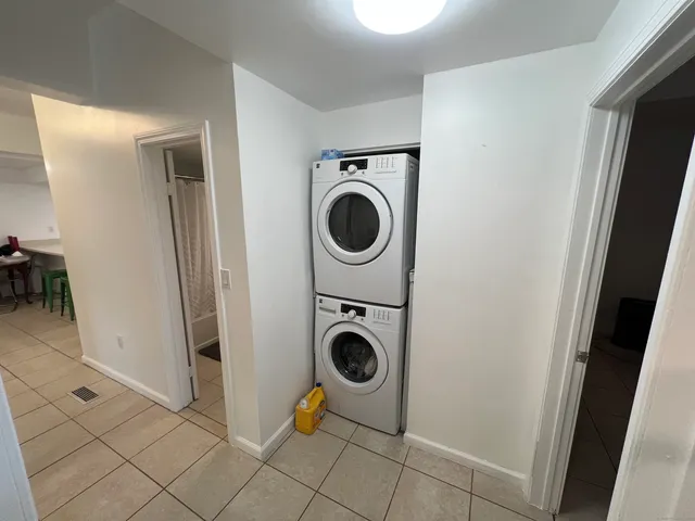 a view of storage and utility room with washer and dryer