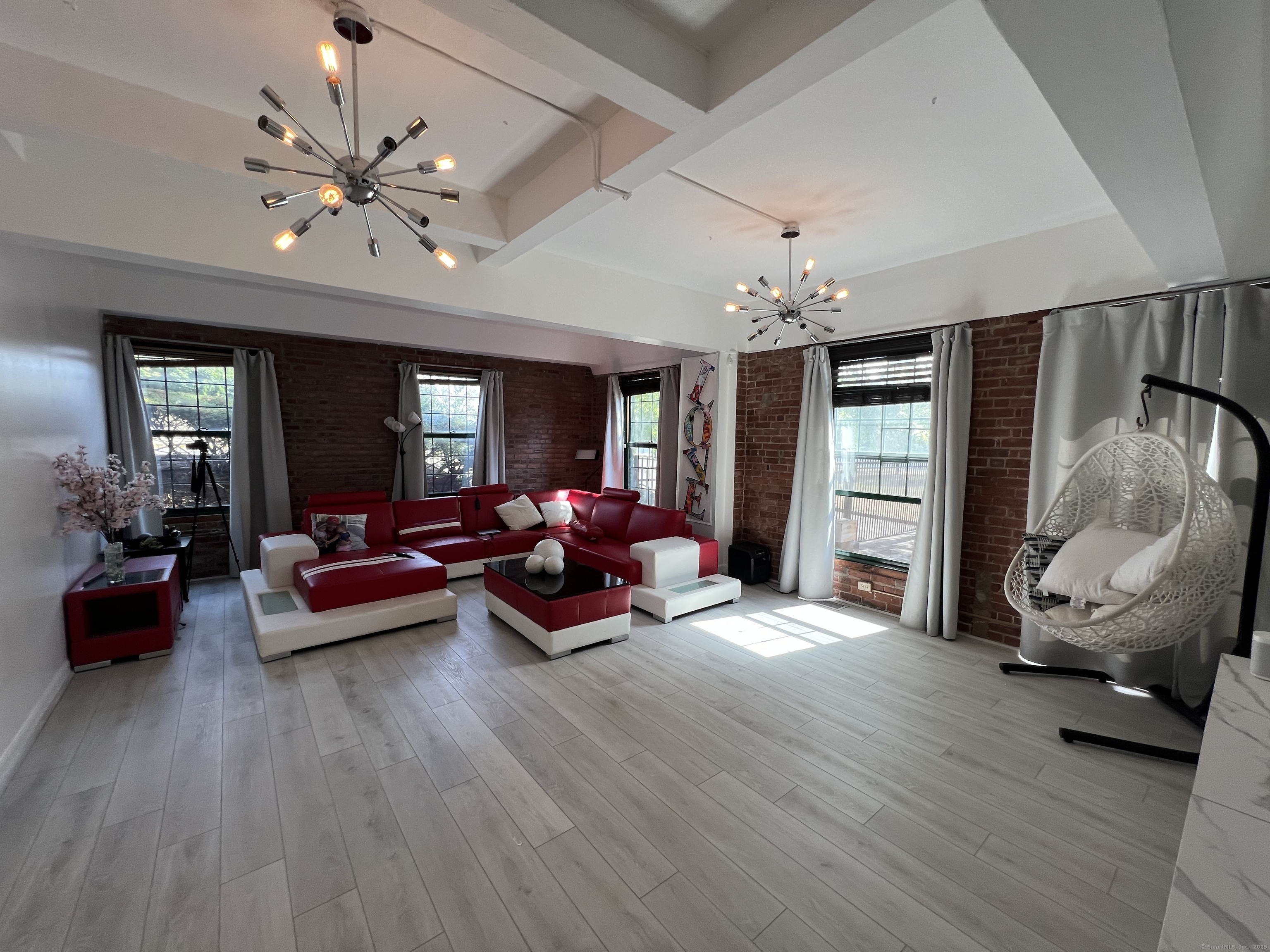 1 Front Street, Unit 1 New Haven, CT 06513 - Photo 17 of 23 a living room with furniture and wooden floor