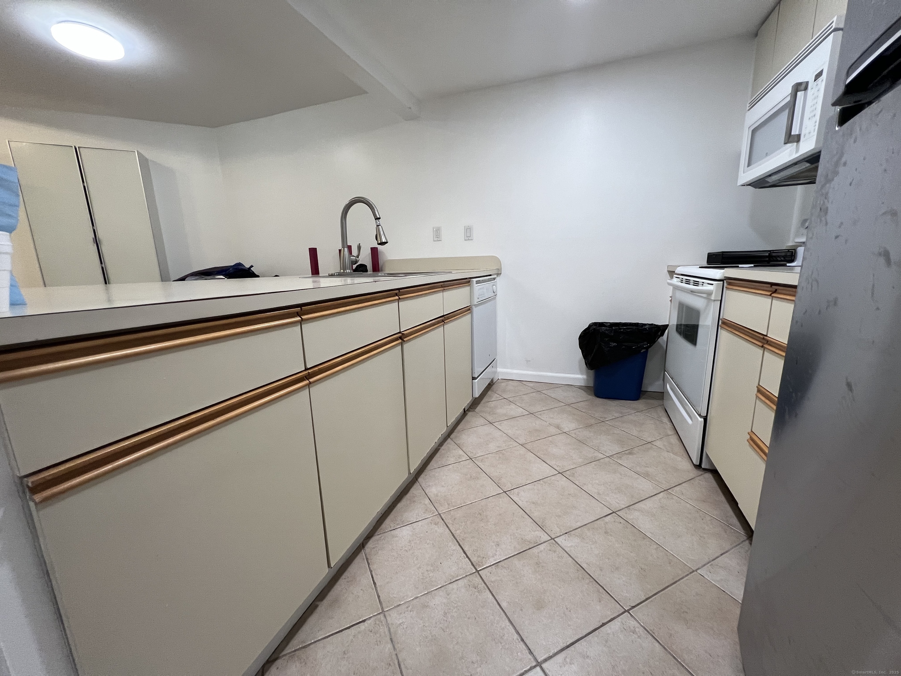 1 Front Street, Unit 1 New Haven, CT 06513 - Photo 7 of 23 a kitchen with a sink cabinets and appliances
