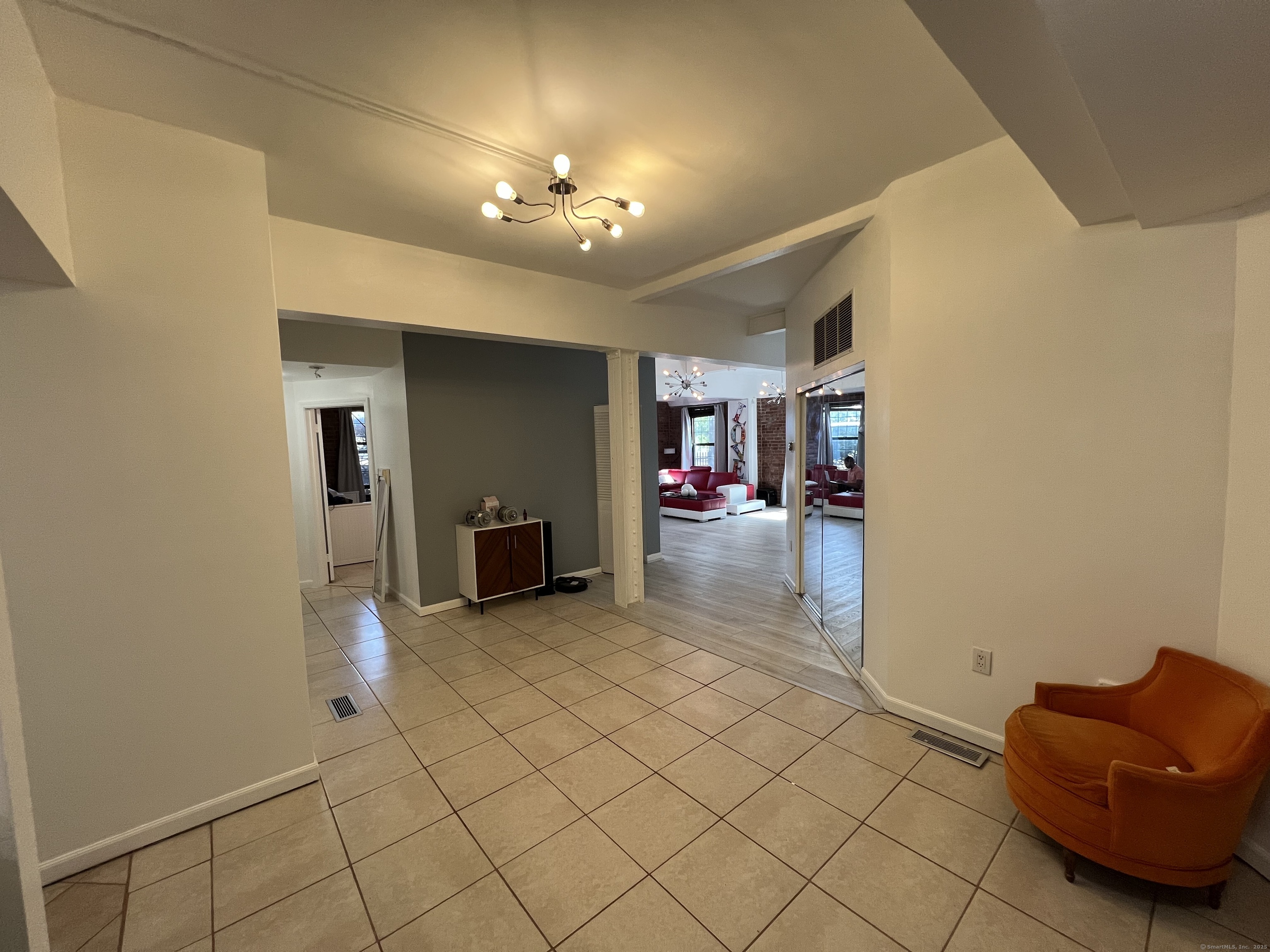 1 Front Street, Unit 1 New Haven, CT 06513 - Photo 9 of 23 a living room with furniture and a chandelier