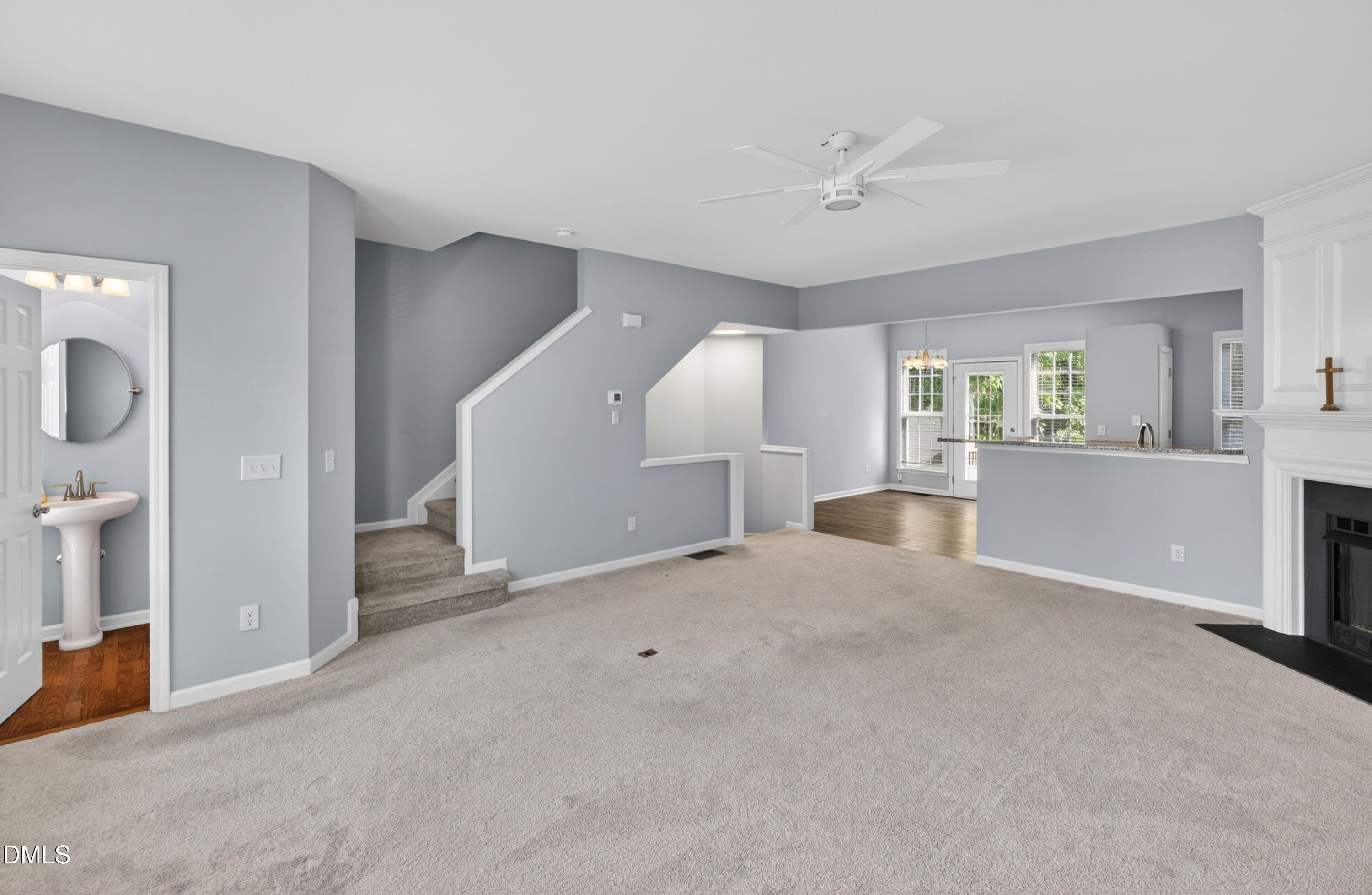 5421 Golden Arrow Lane Raleigh, NC 27613 - Photo 15 of 49 a view of a livingroom with a white furniture and wooden floor