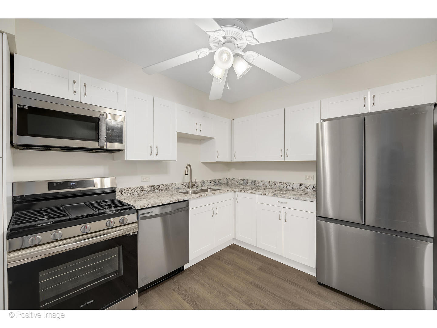 10377 Dearlove Road, Unit 5205 Glenview, IL 60025 - Photo 12 of 23 a kitchen with a refrigerator stove and microwave