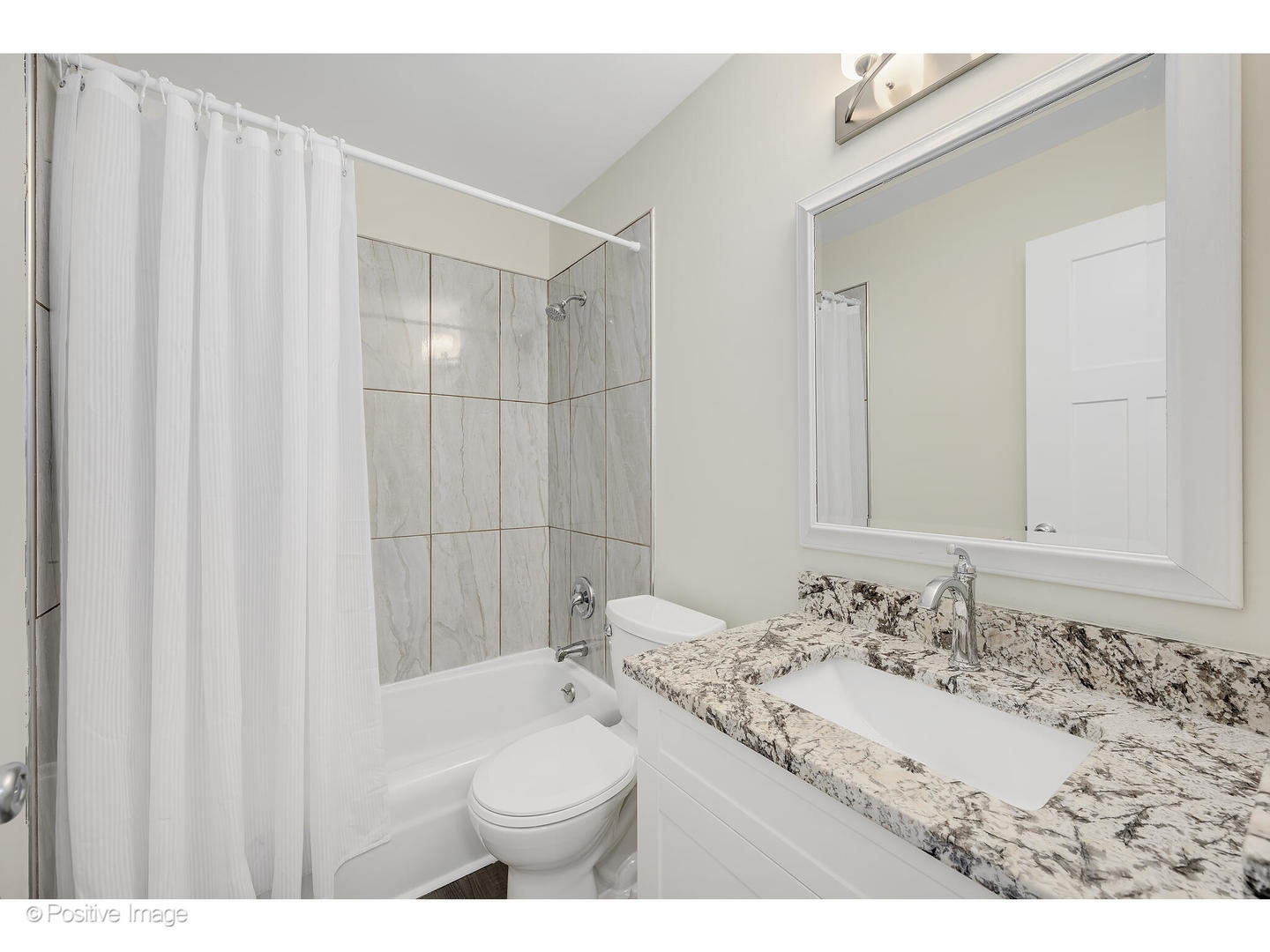 10377 Dearlove Road, Unit 5205 Glenview, IL 60025 - Photo 15 of 23 a bathroom with a sink and a mirror