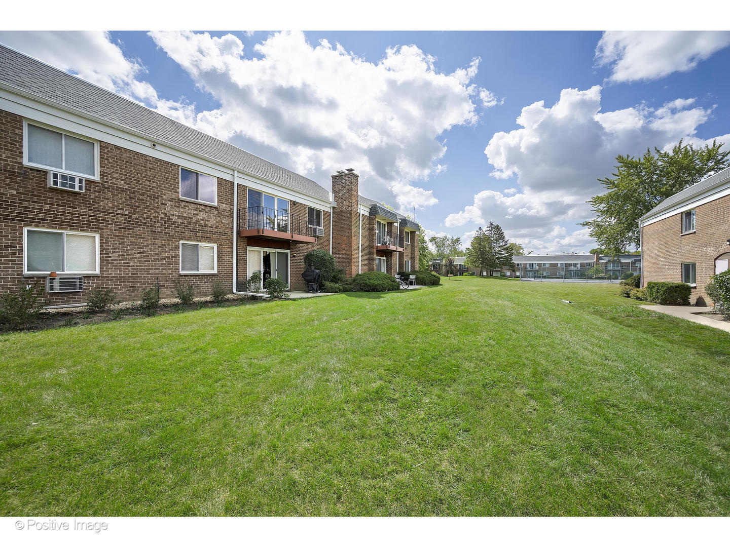 10377 Dearlove Road, Unit 5205 Glenview, IL 60025 - Photo 18 of 23 a view of a house with a big yard