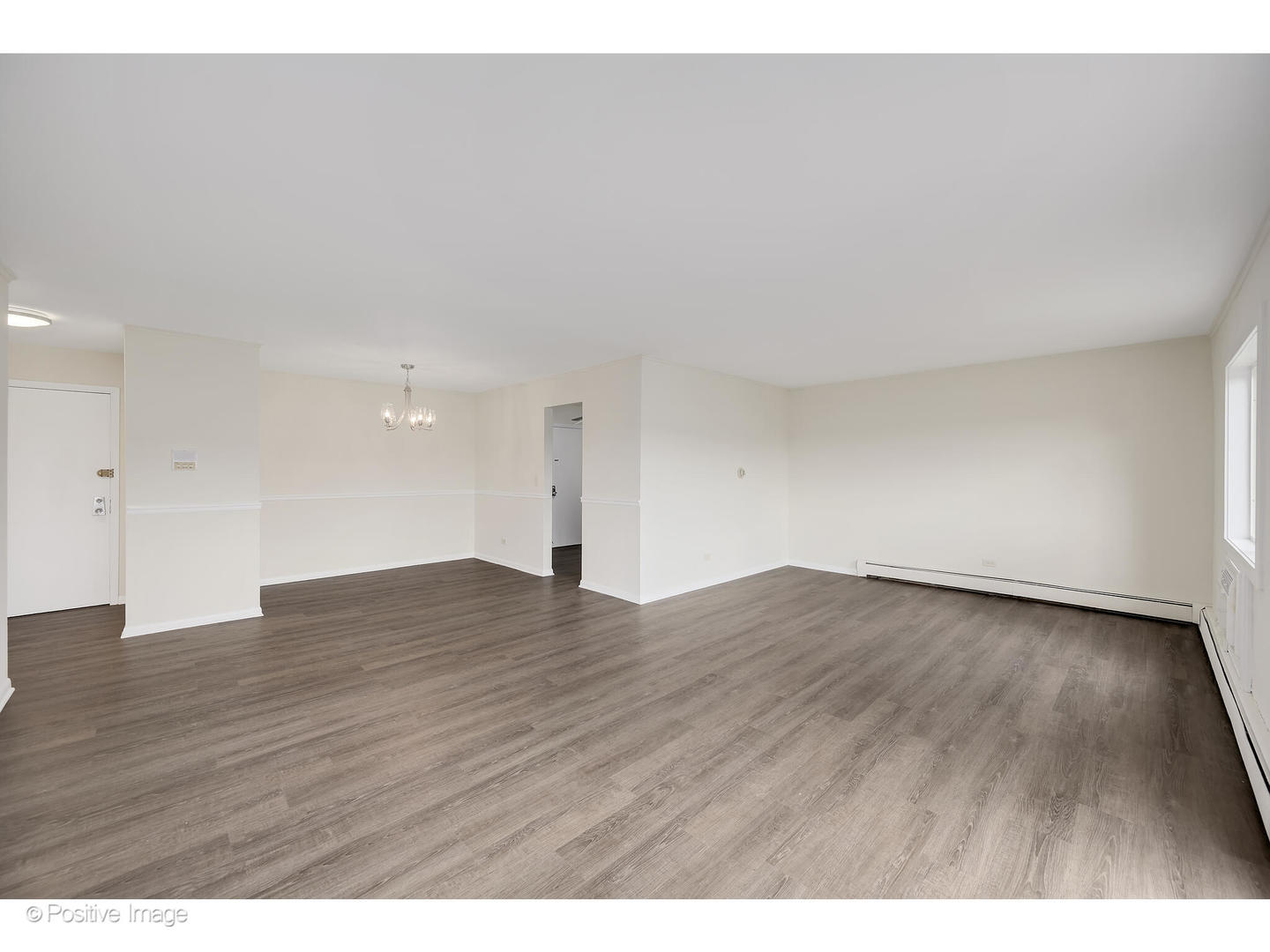 10377 Dearlove Road, Unit 5205 Glenview, IL 60025 - Photo 5 of 23 a view of an empty room and wooden floor