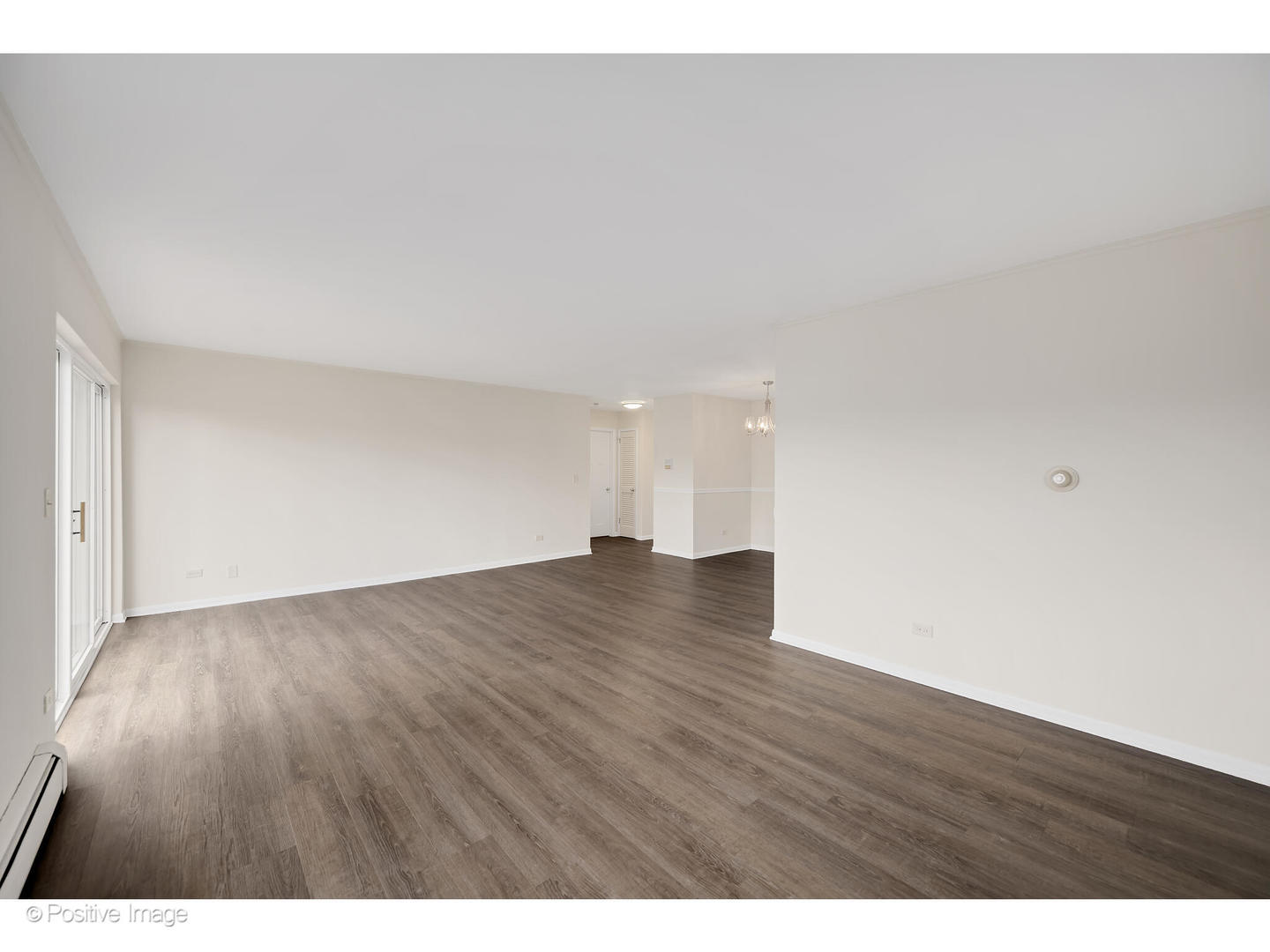 10377 Dearlove Road, Unit 5205 Glenview, IL 60025 - Photo 8 of 23 a view of an empty room and wooden floor