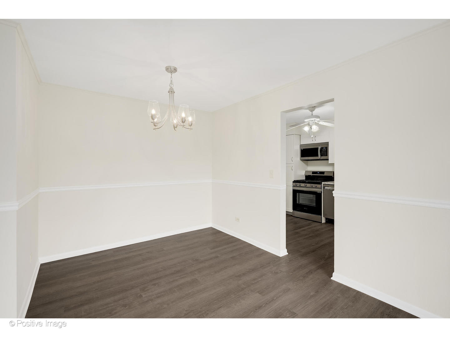 10377 Dearlove Road, Unit 5205 Glenview, IL 60025 - Photo 10 of 23 a view of empty room with wooden floor