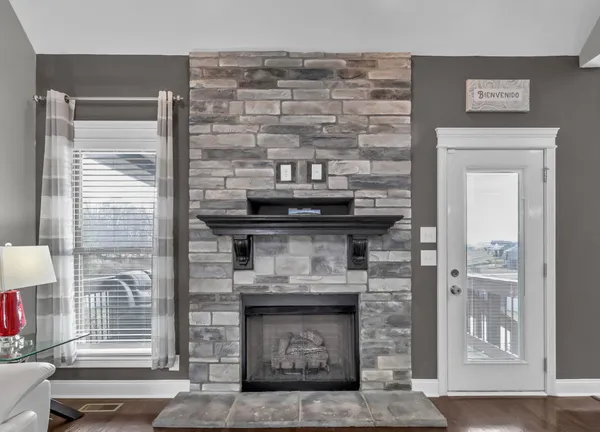 a view of fireplace and window