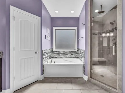 a view of a bathroom with a glass door shower