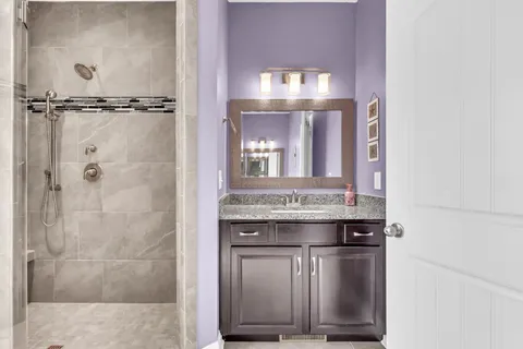 a bathroom with a shower and a window