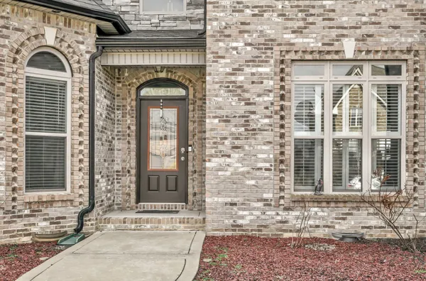 a front view of a house with a couple of windows