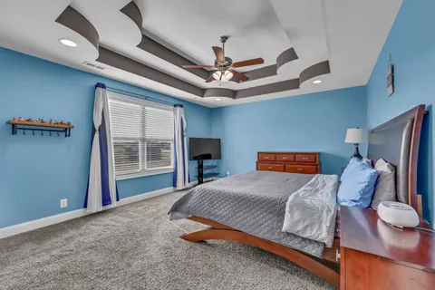 a balcony with wooden floor and outdoor seating