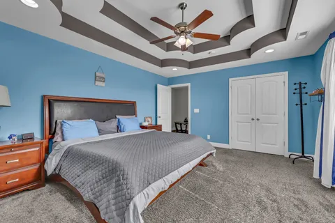 a view of a backyard with sitting area