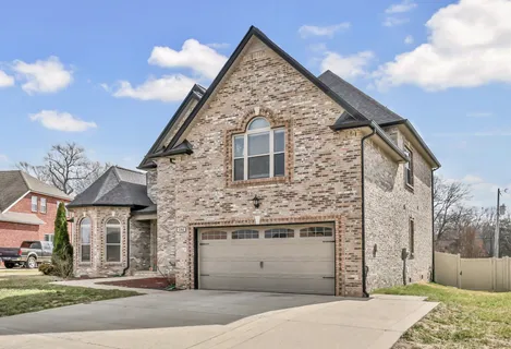 a view of a brick house with a large windows