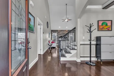 a view of entryway with stairs and wooden floor