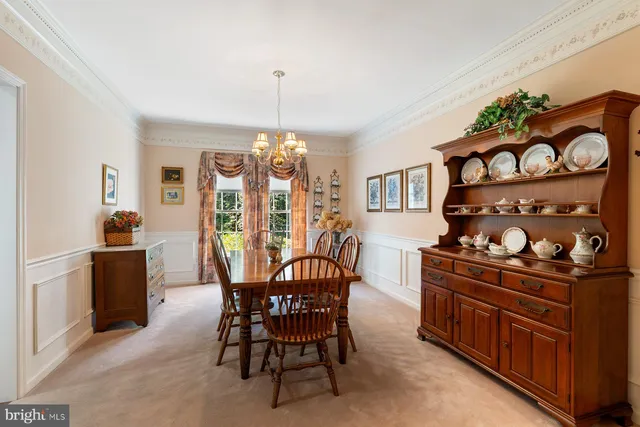 a kitchen with stainless steel appliances granite countertop a stove a sink dishwasher and a wooden cabinets