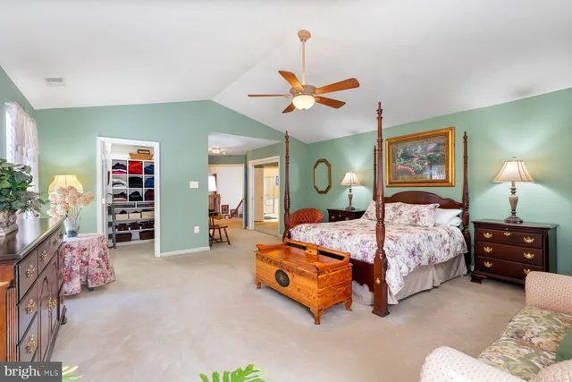 a bedroom with bed and window