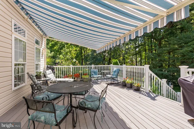 a view of balcony with furniture and wooden floor