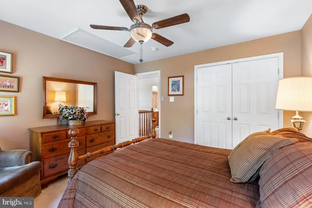 a bedroom with a bed and a dresser