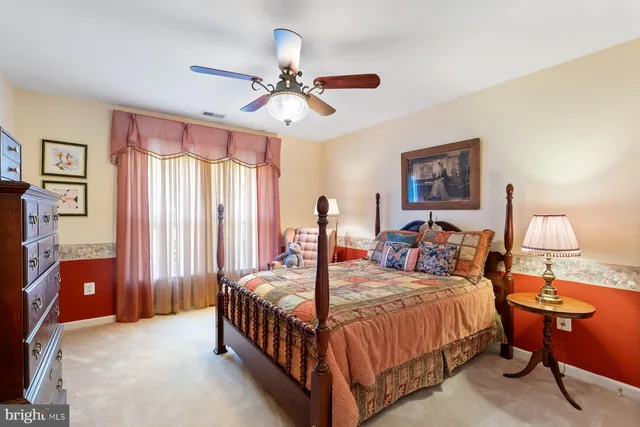 a bed room with a bed and a chandelier