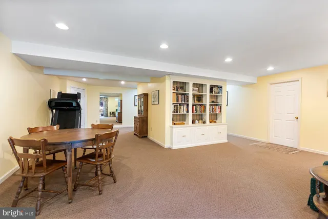 a view of a dining room with furniture and window