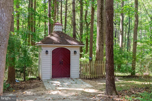 a aerial view of a house with a yard