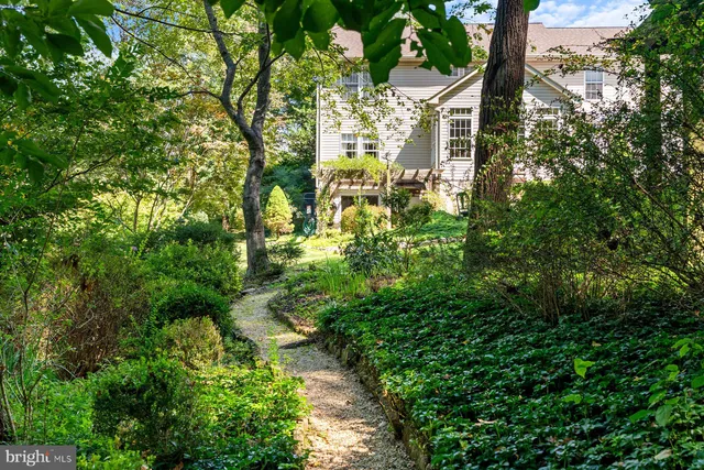 a view of outdoor dining space with a patio and a garden
