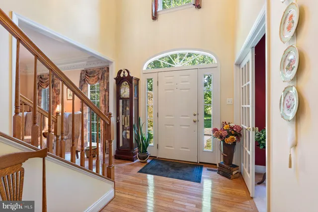 a view of an entryway with wooden floor