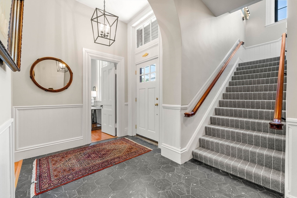 44 Pleasant Street, Unit 1 Marblehead, MA 01945 - Photo 14 of 35 a view of a hallway with entryway wooden floor and front door