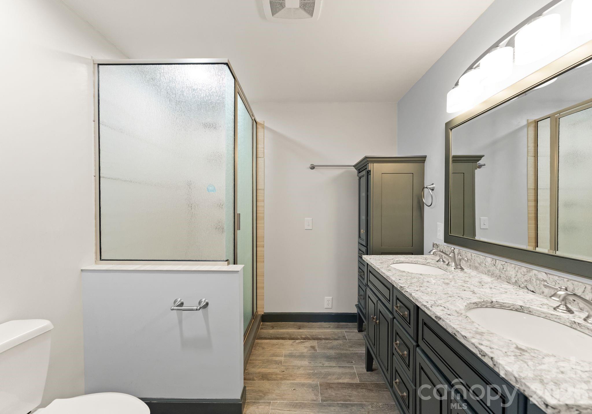 150 Barber Lyerly Road Salisbury, NC 28147 - Photo 17 of 43 a bathroom with a granite countertop sink toilet and shower