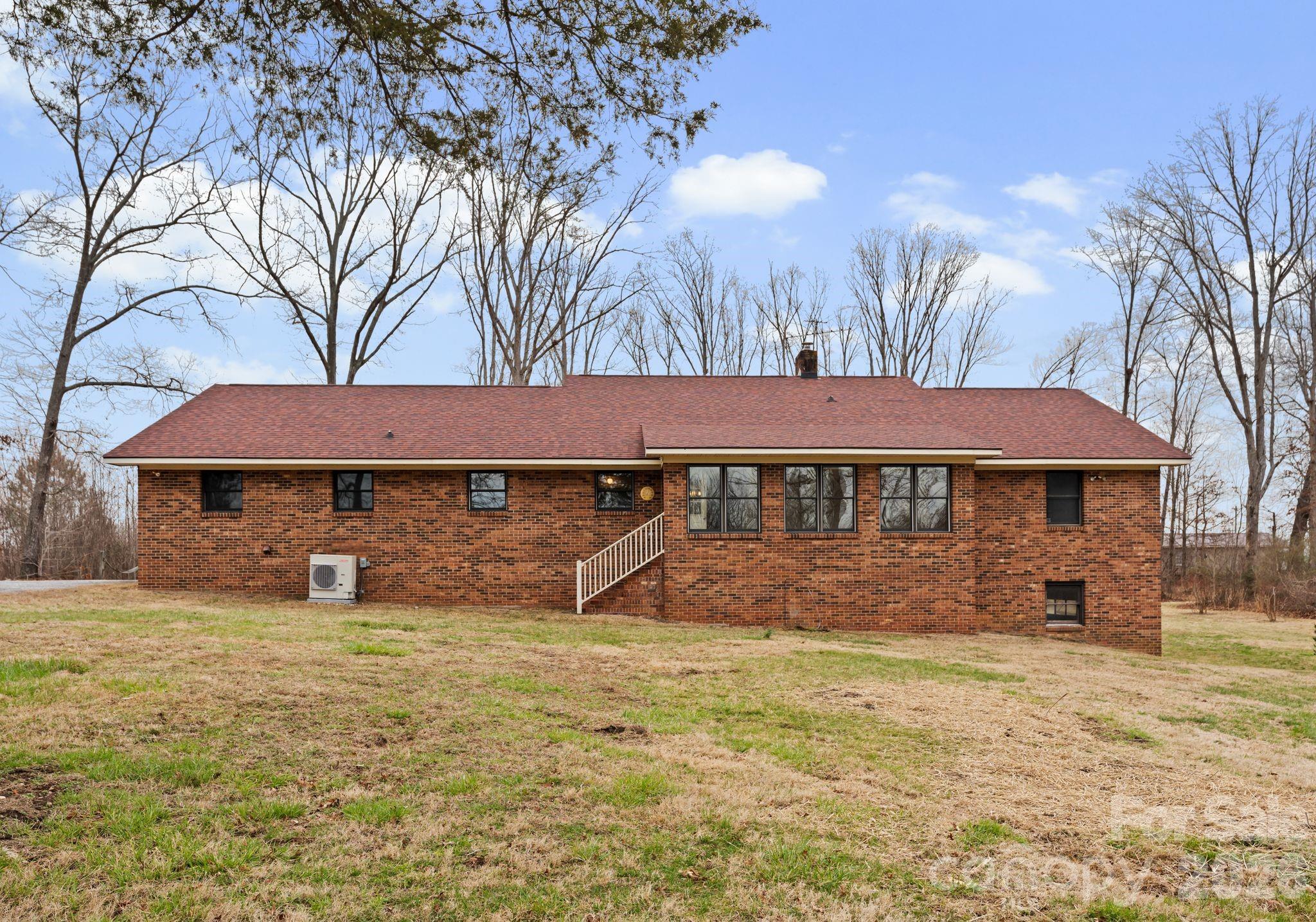 150 Barber Lyerly Road Salisbury, NC 28147 - Photo 28 of 43 a backyard of a house with yard and outdoor seating