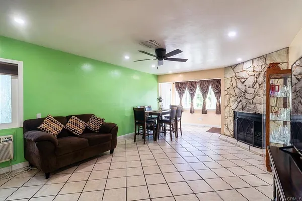 a living room with furniture and a fireplace