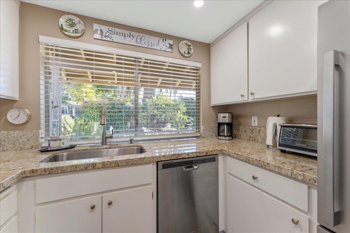 7770 Laurel Drive Gilroy, CA 95020 - Photo 12 of 35 a kitchen with granite countertop a sink and a window