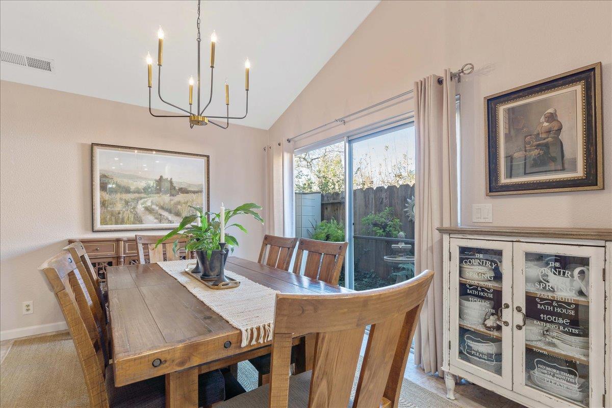 7770 Laurel Drive Gilroy, CA 95020 - Photo 13 of 35 a view of a dining room with furniture large window and wooden floor