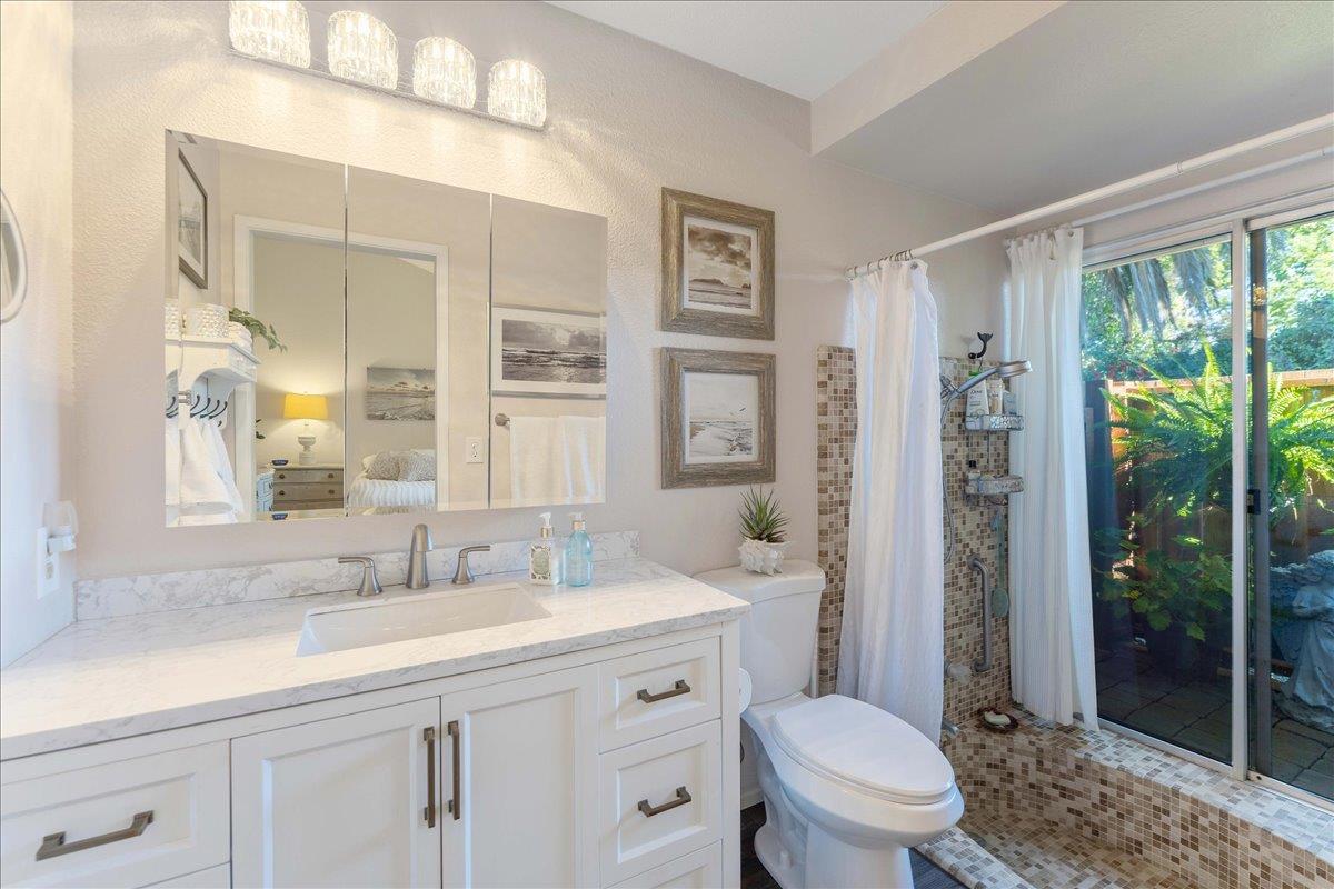 7770 Laurel Drive Gilroy, CA 95020 - Photo 22 of 35 a bathroom with a double vanity sink toilet and shower