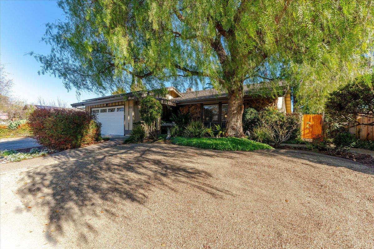 7770 Laurel Drive Gilroy, CA 95020 - Photo 3 of 35 a front view of house with a garden