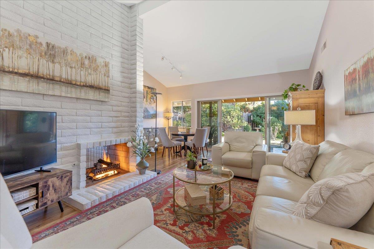 7770 Laurel Drive Gilroy, CA 95020 - Photo 6 of 35 a living room with furniture fireplace and a flat screen tv