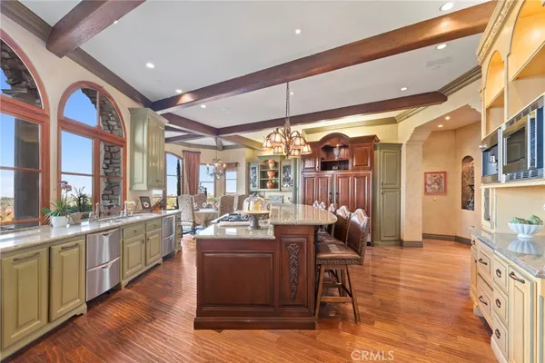 a open kitchen with stainless steel appliances granite countertop a stove and cabinets