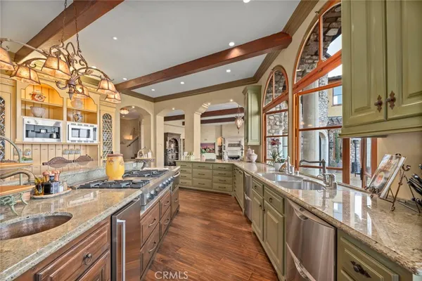 a view of a kitchen cabinets and a stove